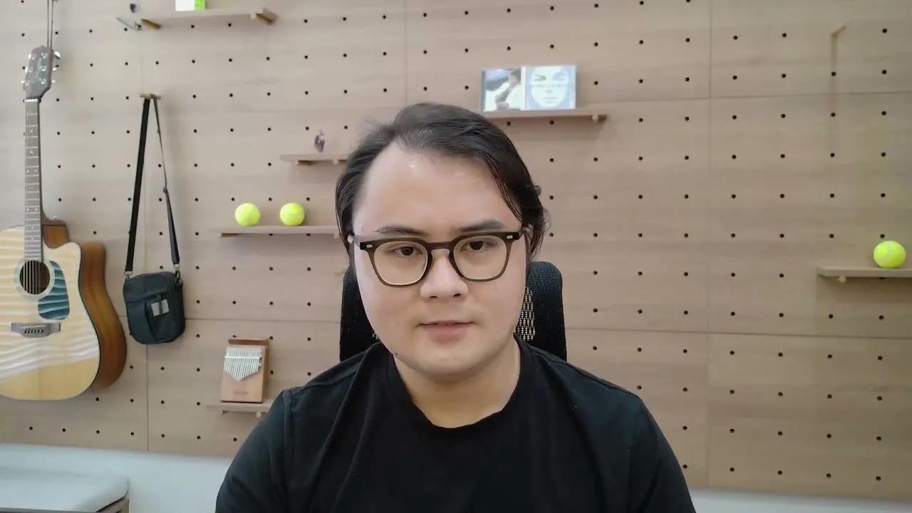 Duy Nguyen, founder of GUDJOB, speaking to camera in his studio